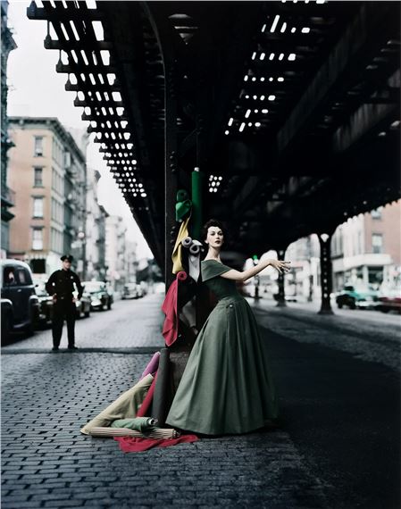 Dovima Under the El, Dior Creates Cosmopolitan Drama, Under 3rd Avenue elevated train, New York, NY. by William Helburn, 1956