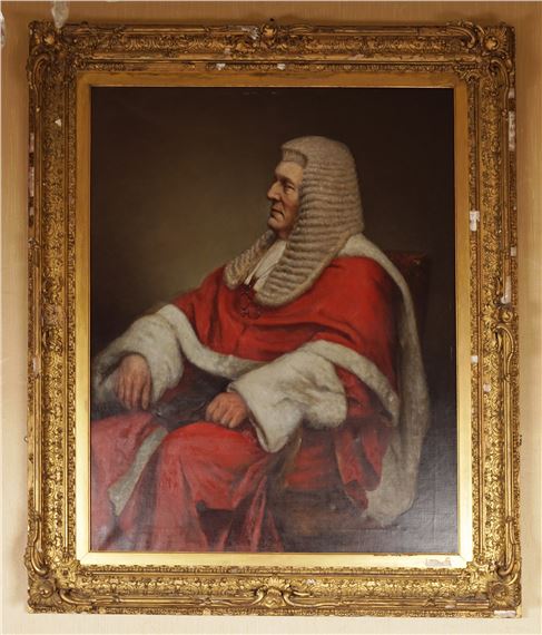 Three-quarter length portrait of a seated judge wearing a red robe - Emilie Sheen