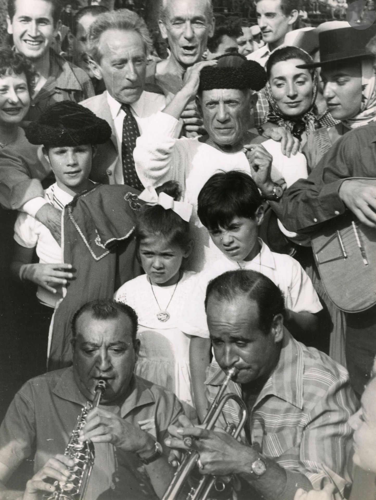 Pablo Picasso, Paloma, Jacqueline, Claude, Jacques-Henri Lartigue and Jean Cocteau at the Vallauris bullfight. The painter in his studio by Edward Quinn, c. 1955