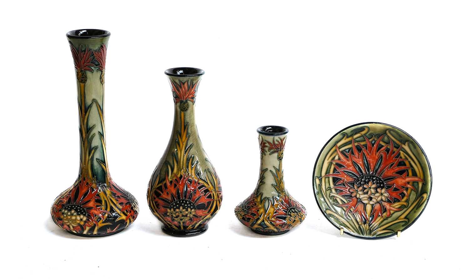 Nicola Slaney Three graduating modern Moorcroft vases and a pin dish