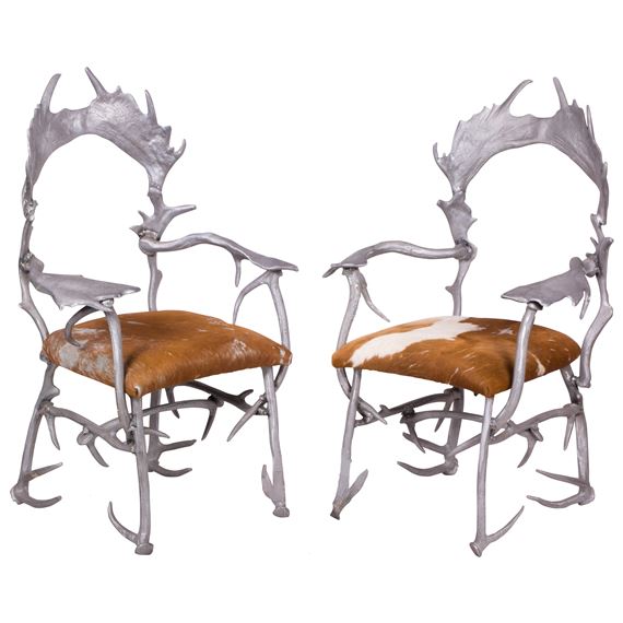 pair cast aluminum and cowhide upholstery by Arthur Court