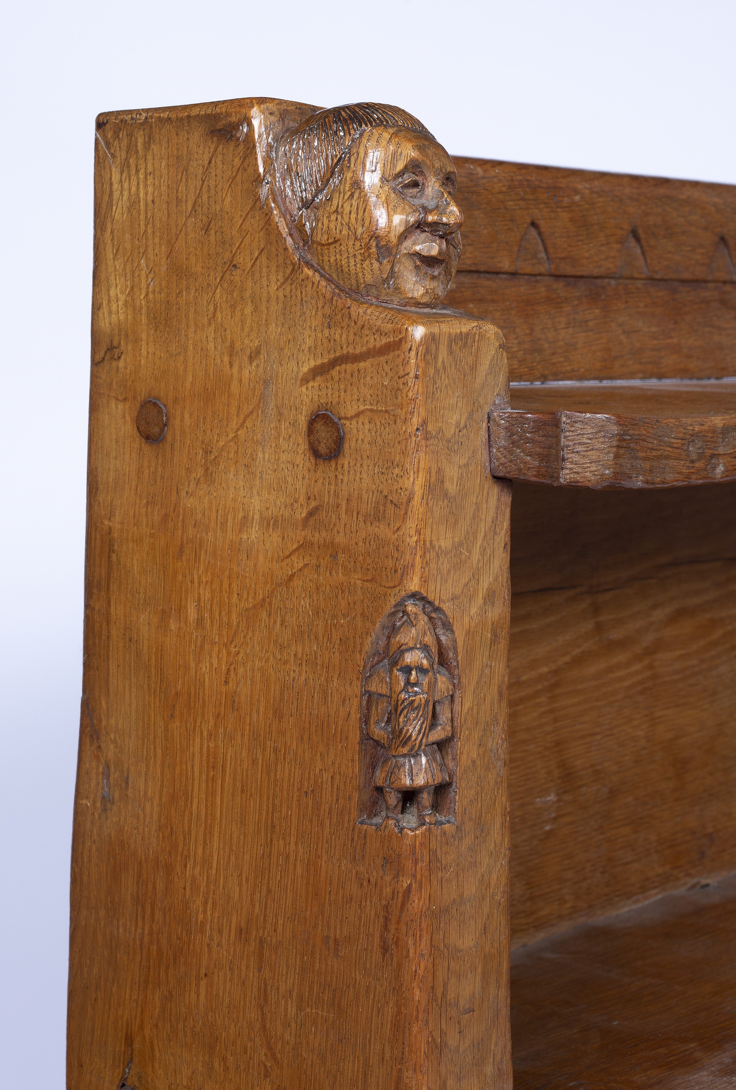 Whittaker | Oak bookcase, with two carved monk`s head terminals, with ...