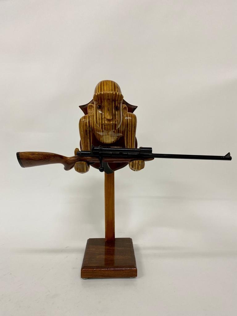 Artwork by Paul Kubic, Trophy hunter, Made of plywood
