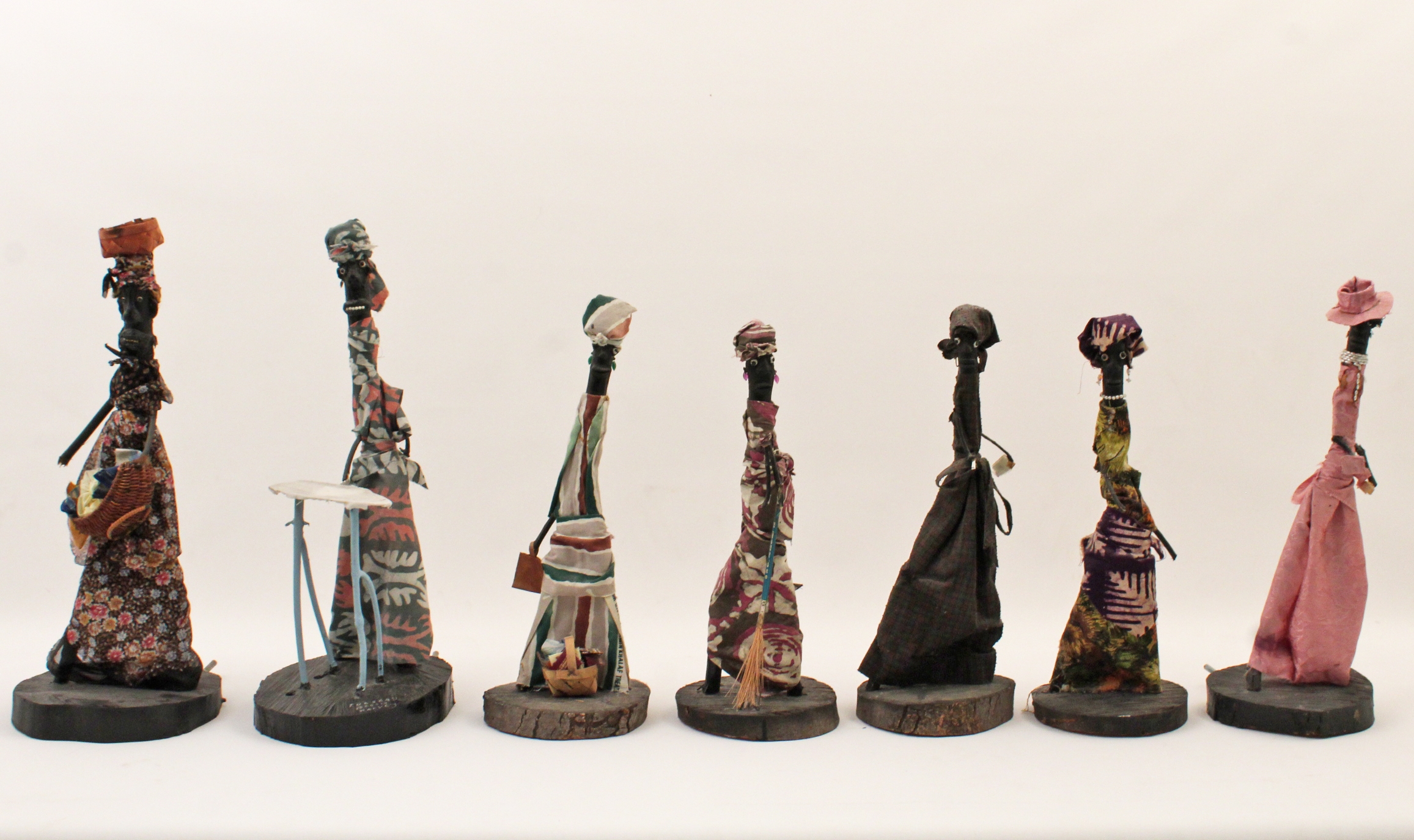 Artwork by Bessie Harvey, Seven Days of the Week, Made of polychrome wood with applied fabric cloth