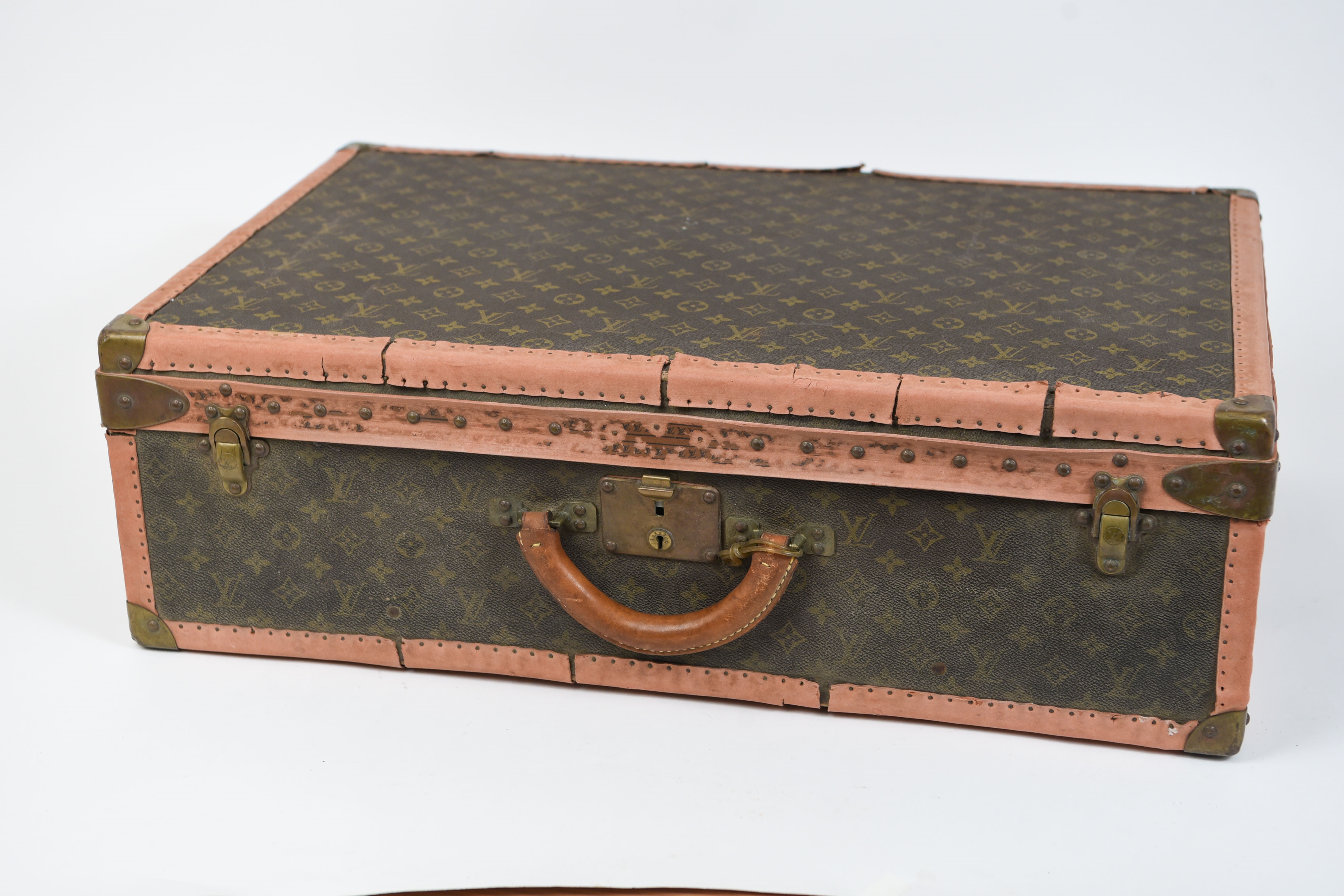 Louis Vuitton, Dimensions: (Suitcase) H 17 x W 25 Condition: Vintage wear  consistent with age and use. Wear to leather piping. Some thread loss to  straps. Some scratches and scuffs.