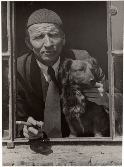 Alfred Renger-Patzsch with dog and cigar. by Sabine Renger, 1946