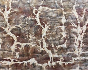 A textured abstract composition featuring organic white lines against a mottled brown background.
