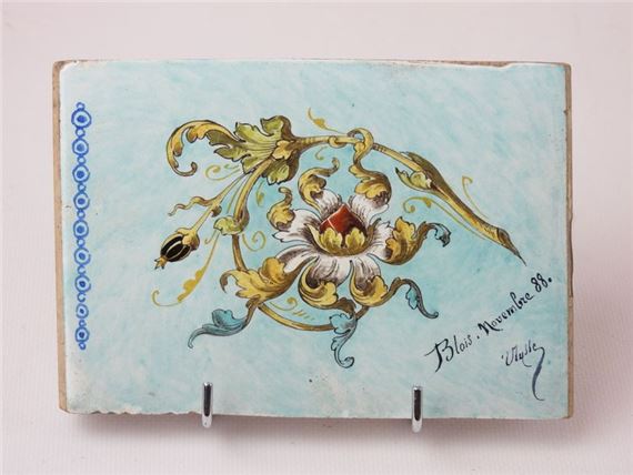 : Earthenware tile decorated with a flowering branch on a celadon background