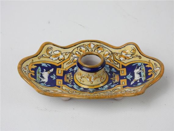 hand candlestick of rectangular form with scalloped edge decorated with two crowned ermines