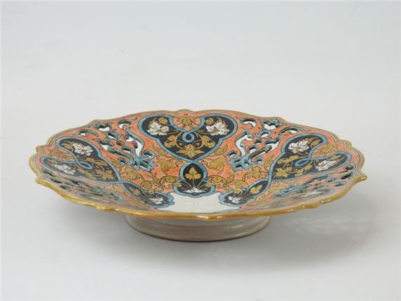 Openwork bowl on heel with floral and interlacing motifs.