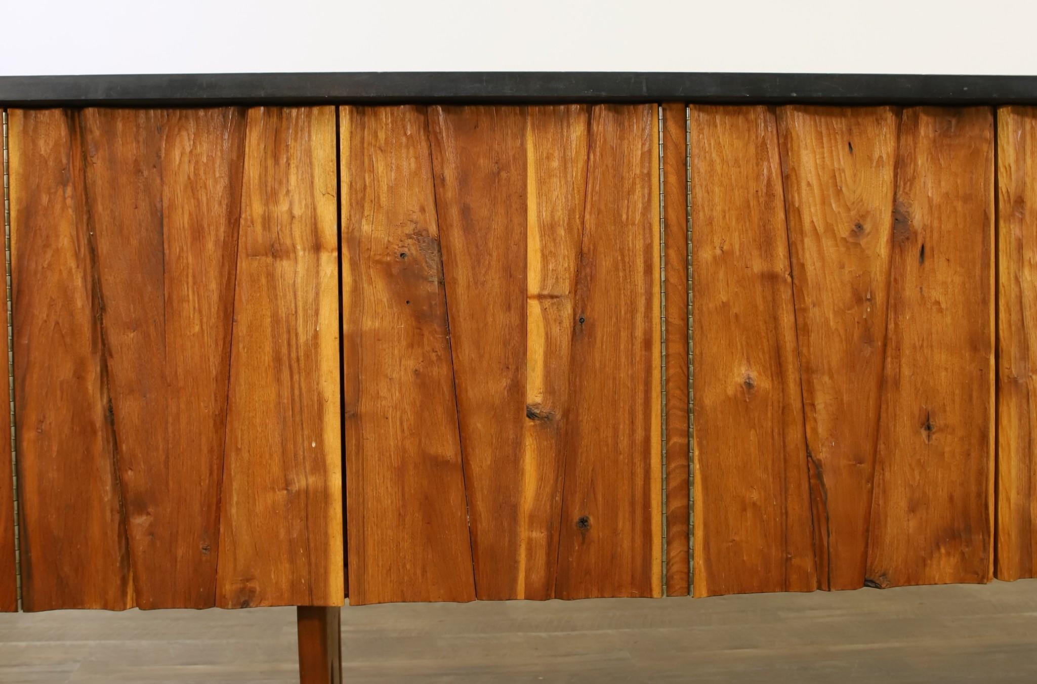 Gino Russo four chipcarved chiseled doors opening to shelving and a