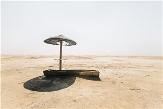 Umbrella in the desert - Micha Serraf