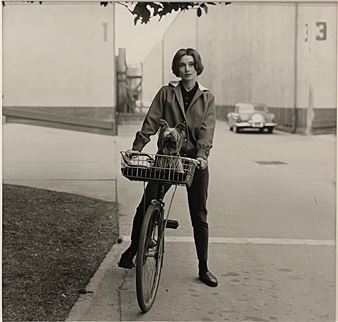 Audrey Hepburn on bike with her dog ‘Famous’ at Paramount Studios - Sid Avery