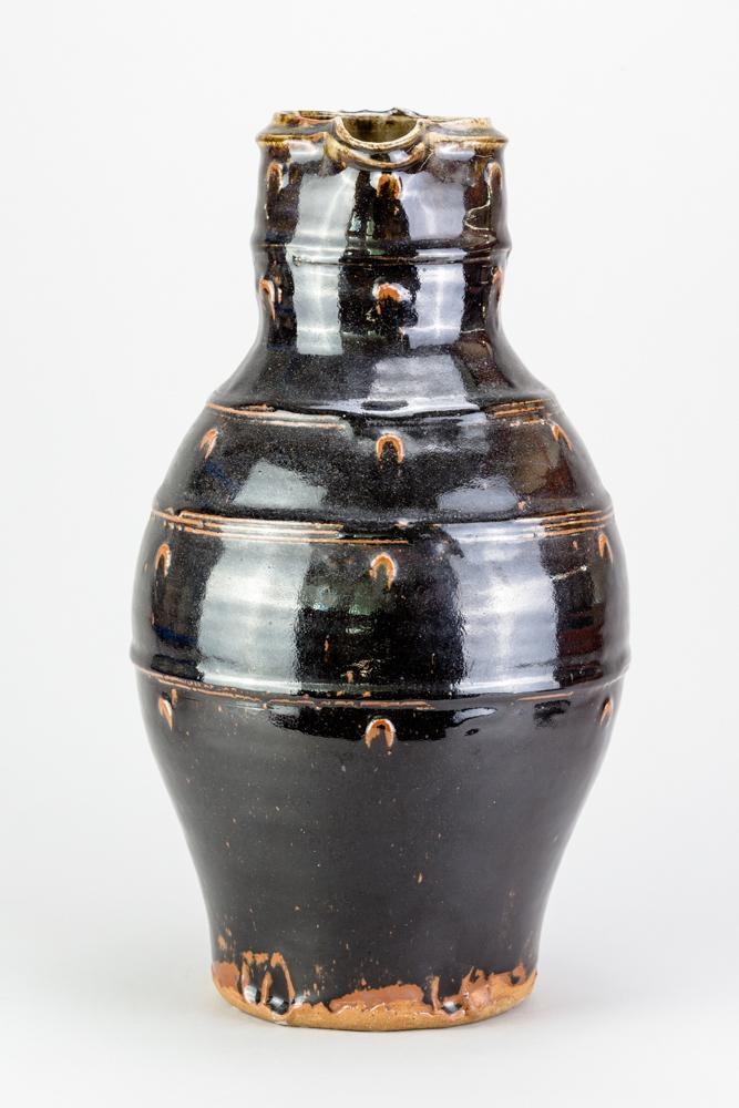 Jim Malone a very large stoneware baluster jug covered in tenmoku