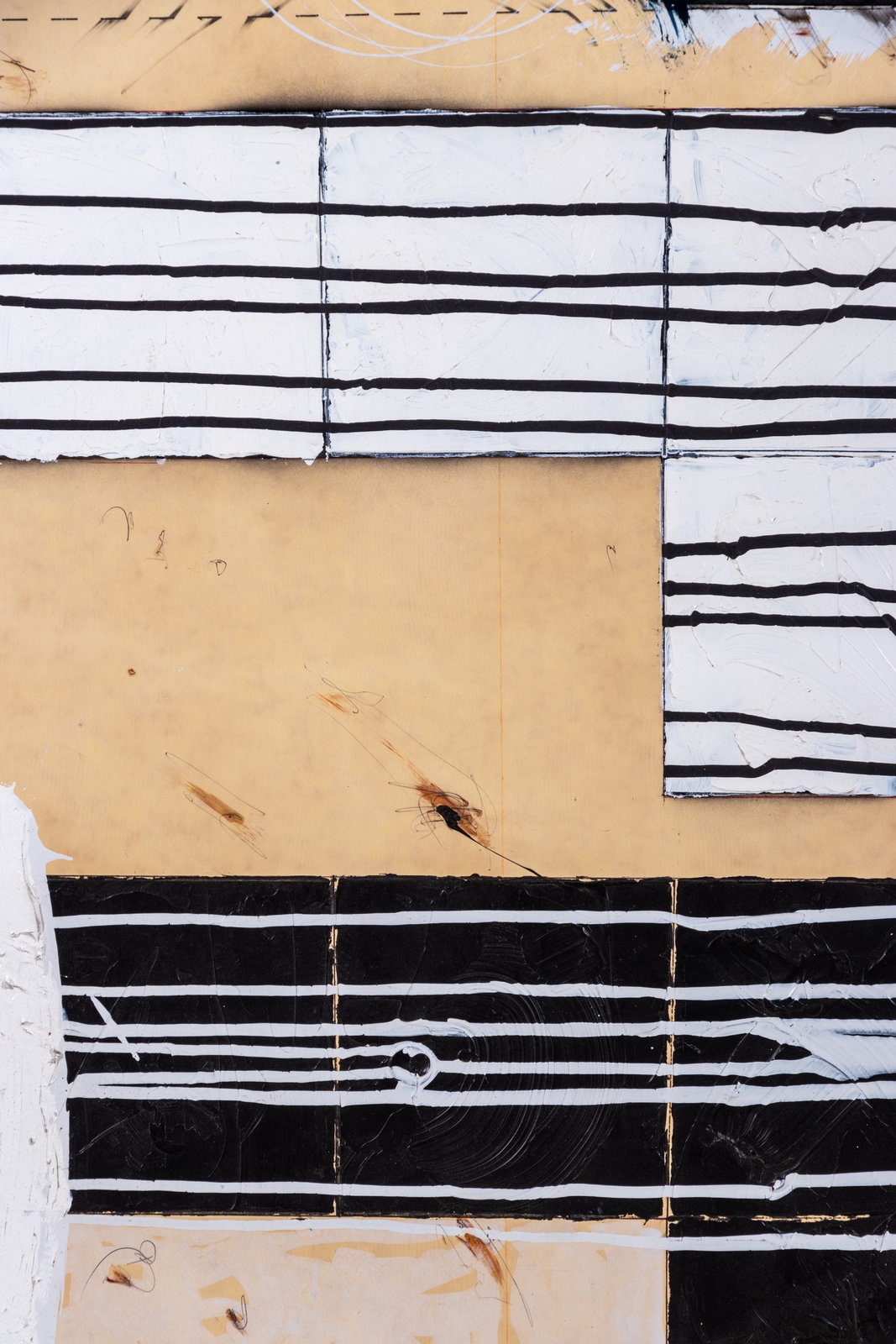 A vertical abstract composition featuring a grid of rectangular blocks in black, white, beige, and yellow.