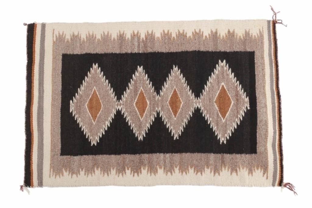 Artwork by Mae Benally, Navajo Eye Dazzler Crownpoint rug, Made of Dyed colors of light brown, black, grey, heathered grey, and cream set to a black field.