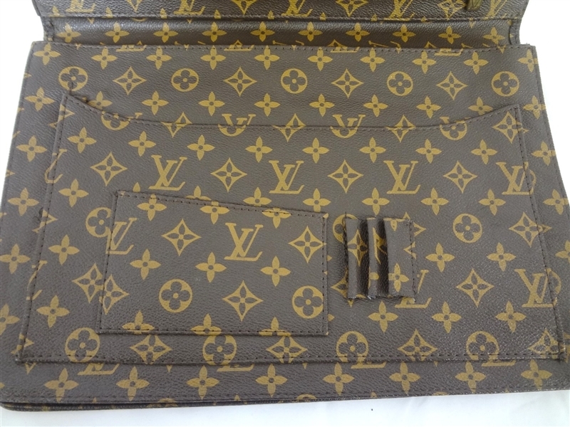 Louis Vuitton  Louis Vuitton Portfolio Document Holder: Lovely Louis  Vuitton Portfolio. With leather edged zipper pocket and LV monogram front.  Folder with pen holders and pockets. Measures 14.5 x 10 with
