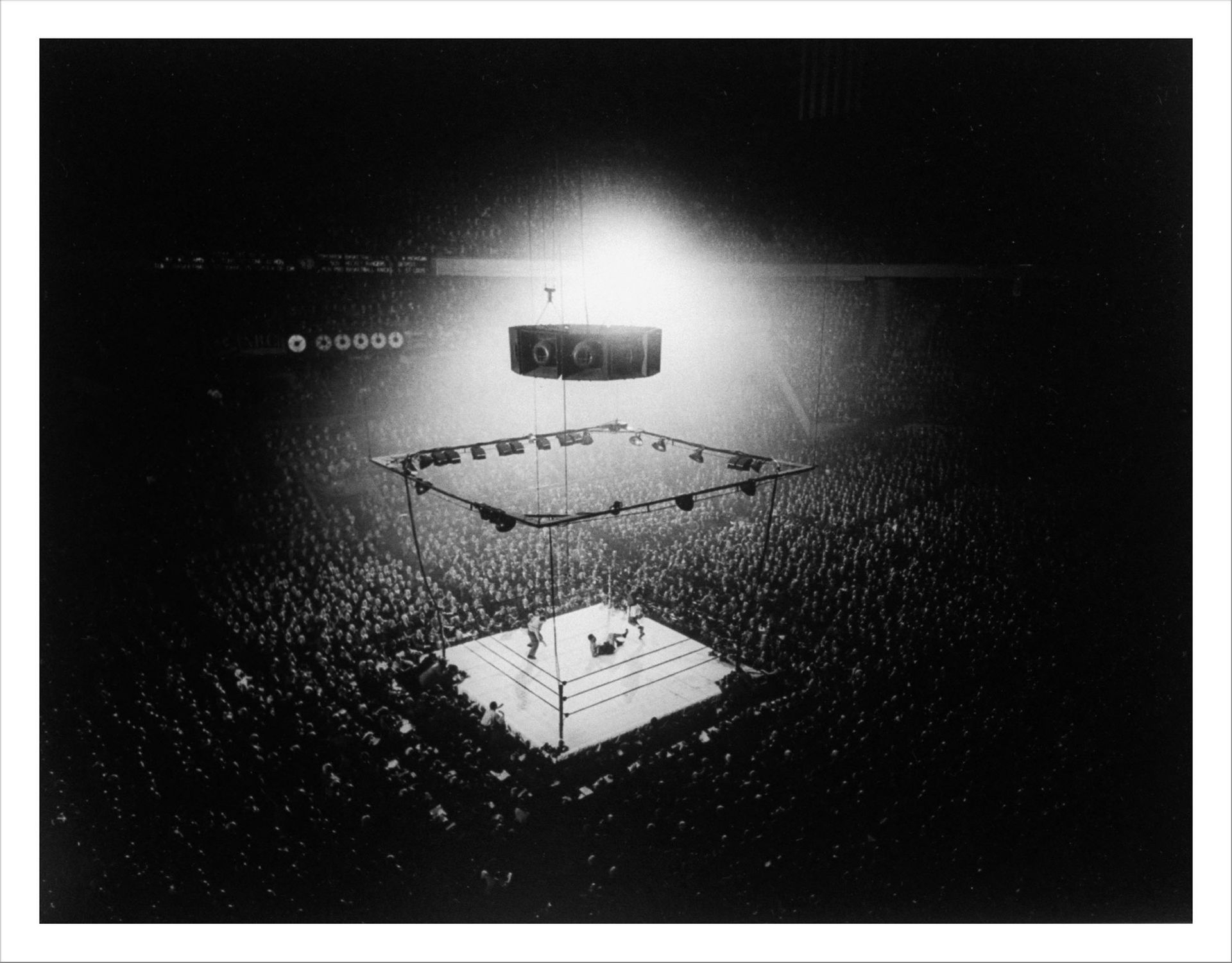 Gjon Mili Spectators around the boxing ring as champion Joe Louis is