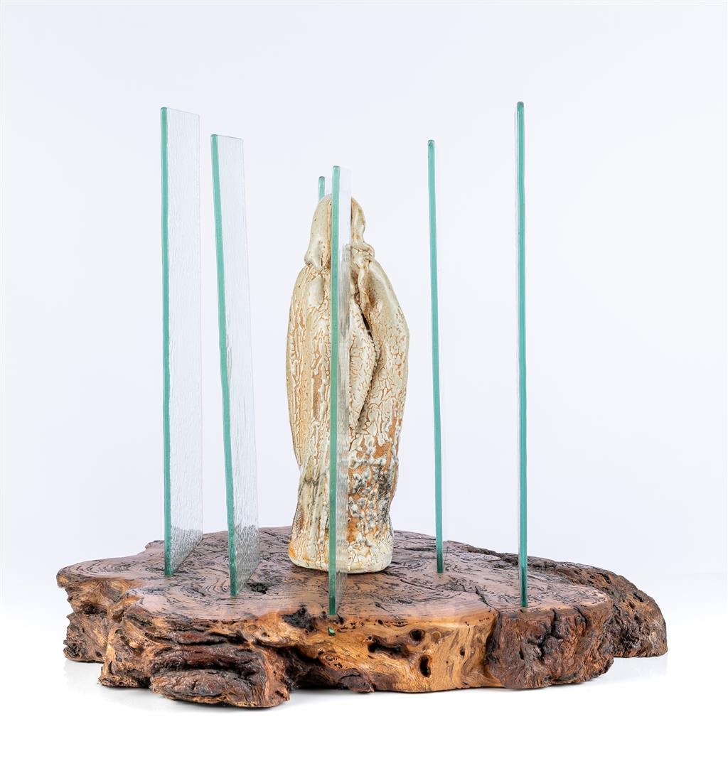 Artwork by Diane Mahoney, Cloaked Figure, Made of glazed ceramic sculpture, glass panels on timber base