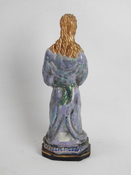 Artwork by Henriette Korner, Subject in polychrome earthenware representing a young girl holding a squirrel, Made of polychrome earthenware