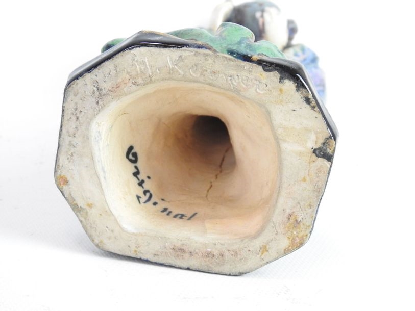 Artwork by Henriette Korner, Subject in polychrome earthenware representing a young girl holding a squirrel, Made of polychrome earthenware