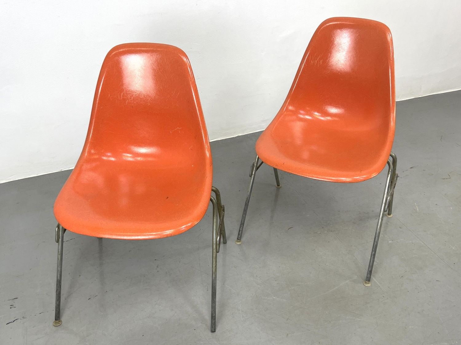 Herman Miller | Pr Orange Eames shell chairs | MutualArt