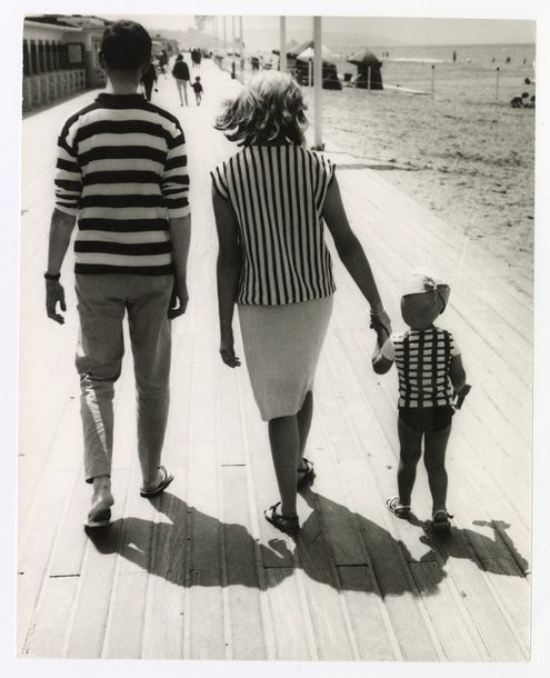 Artwork by René Maltête, Family walking on the boards at Deauville, Made of silver print