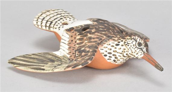 a slip decorated earthenware ocarina in the shape of a snipe by Neil Ions, dated 1994