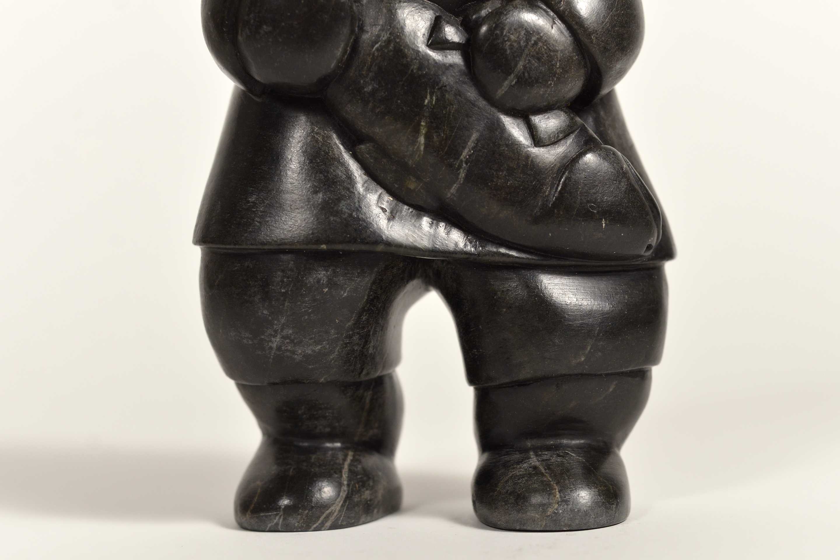 Artwork by Conlucy Nayoumealook, Pècheur avec sa prise, Made of Stone