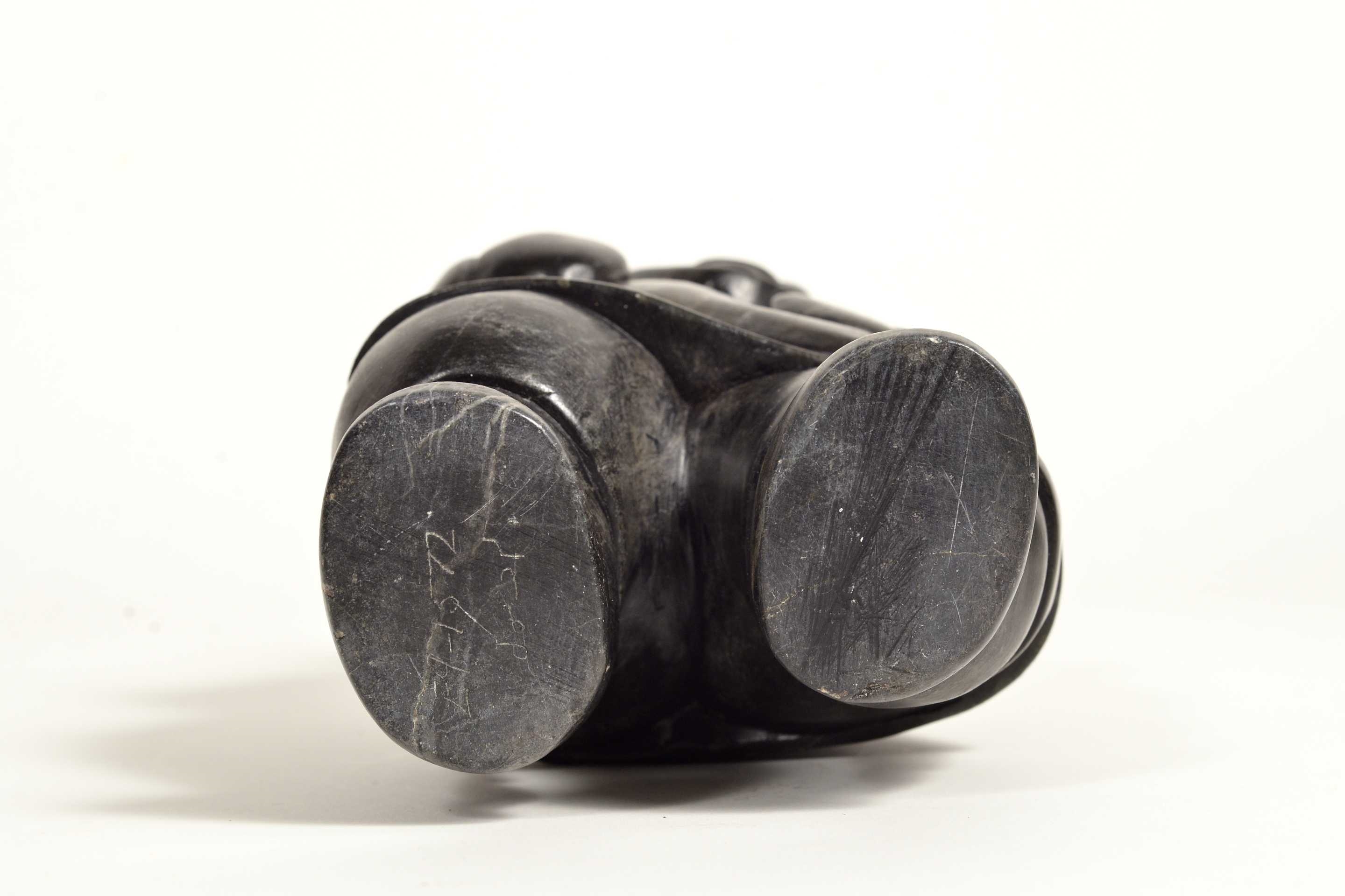 Artwork by Conlucy Nayoumealook, Pècheur avec sa prise, Made of Stone