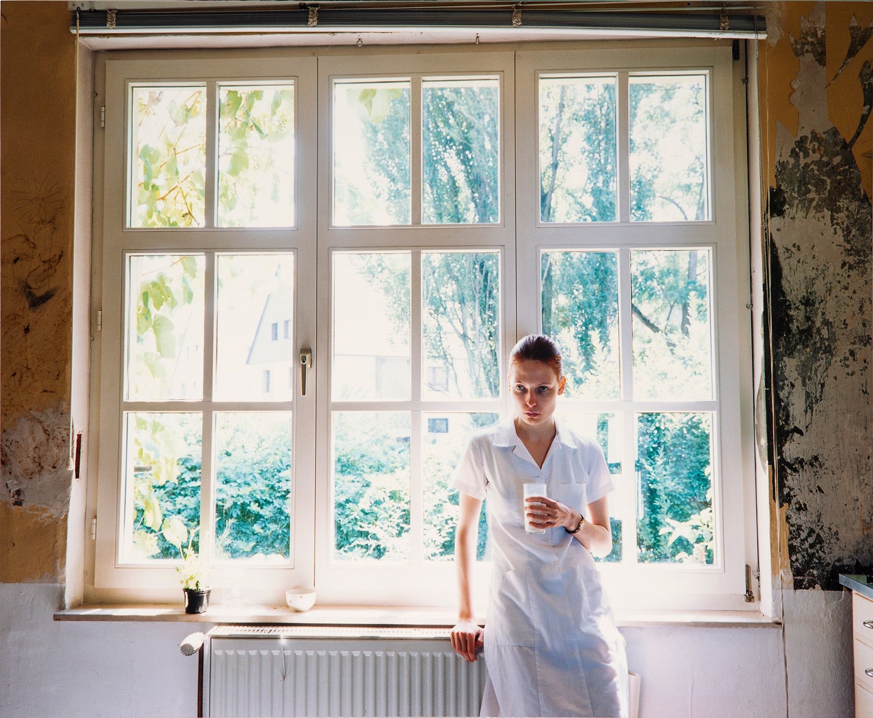 Artwork by Aino Kannisto, Untitled (Woman in front of window), Made of C print on photographic paper mounted on aluminum