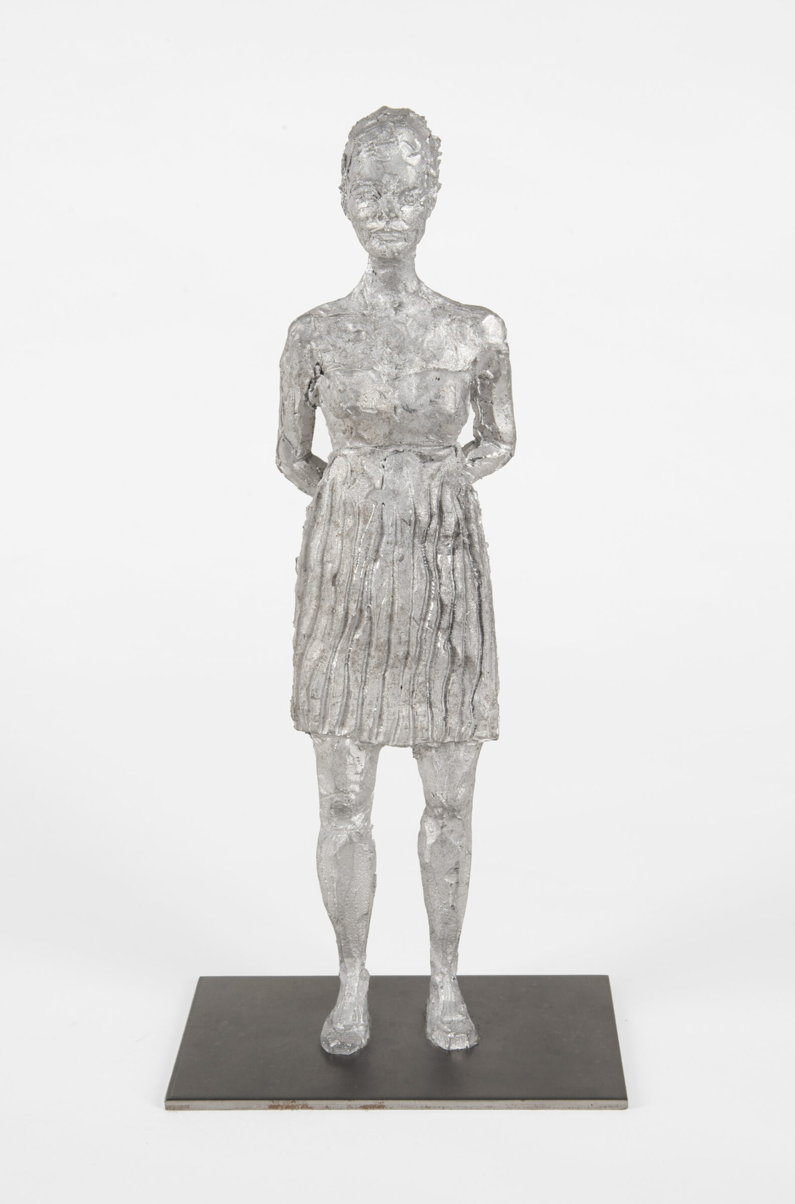 Artwork by Stephan Balkenhol, Stehende Frau, Made of Antimony hard lead cast, mounted on a metal plinth