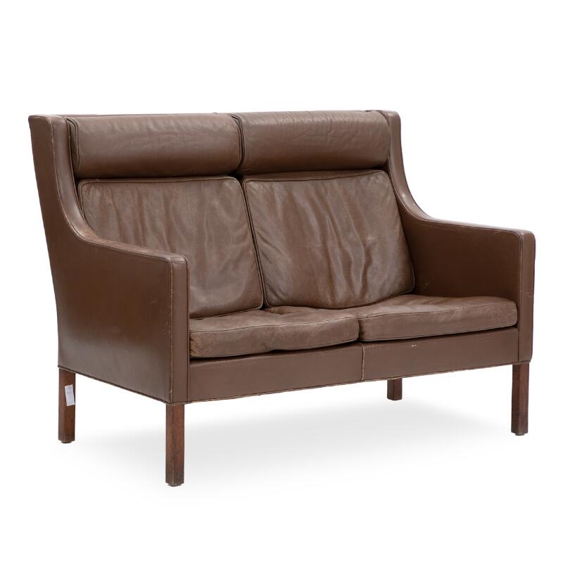 Børge Mogensen A highback three seater sofa with stained oak legs