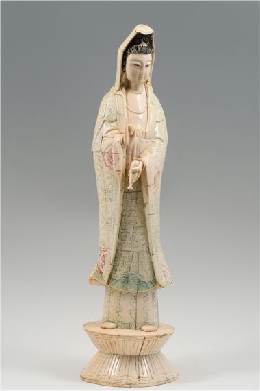 Bone clad Quan Yin holding a bottle that holds the water of life in one hand by Yin Quan