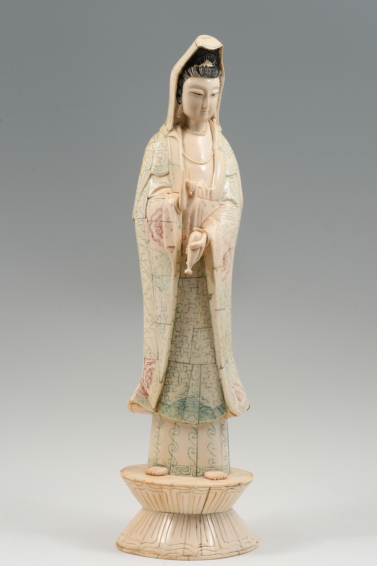 Quan Yin Bone clad Quan Yin holding a bottle that holds the water of