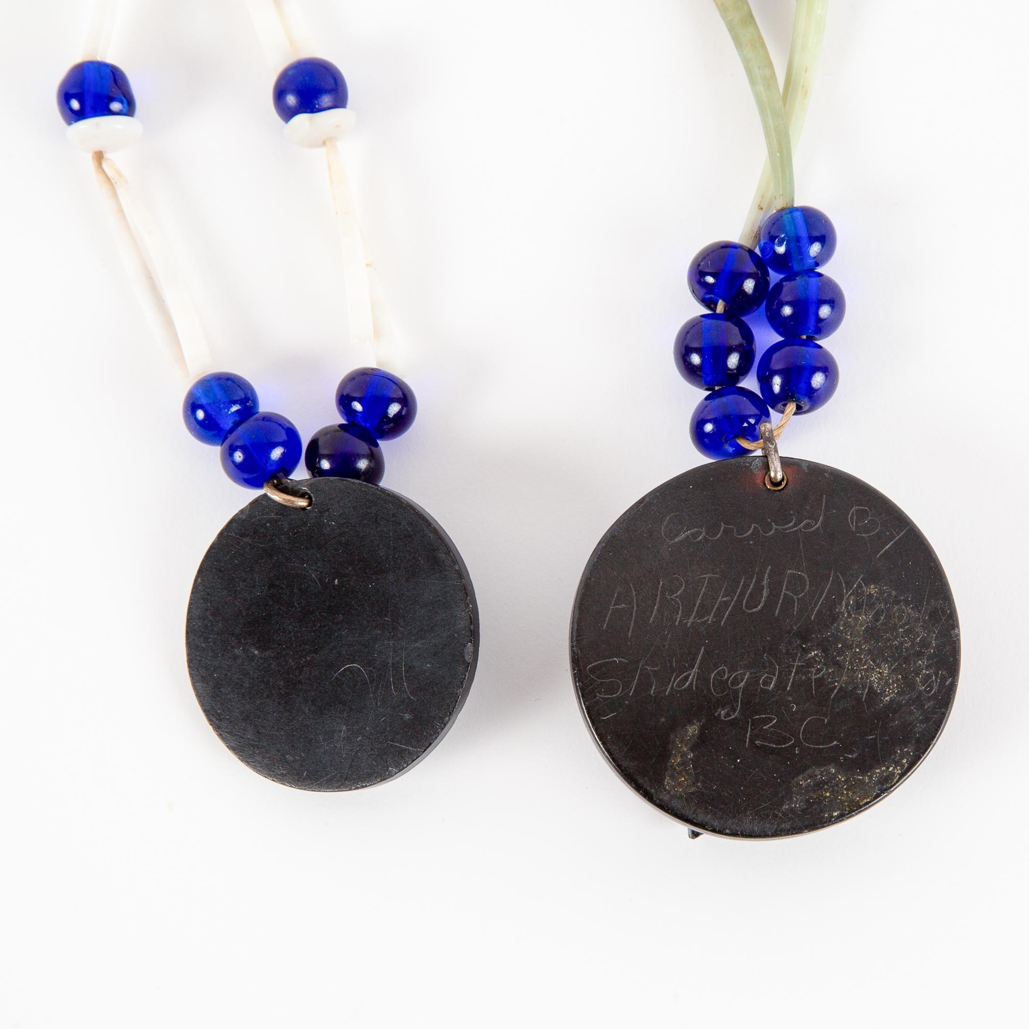 Arthur Moody | TWO ARGILLITE PENDANTS, EAGLE AND FROG, WITH DENTALIUM ...