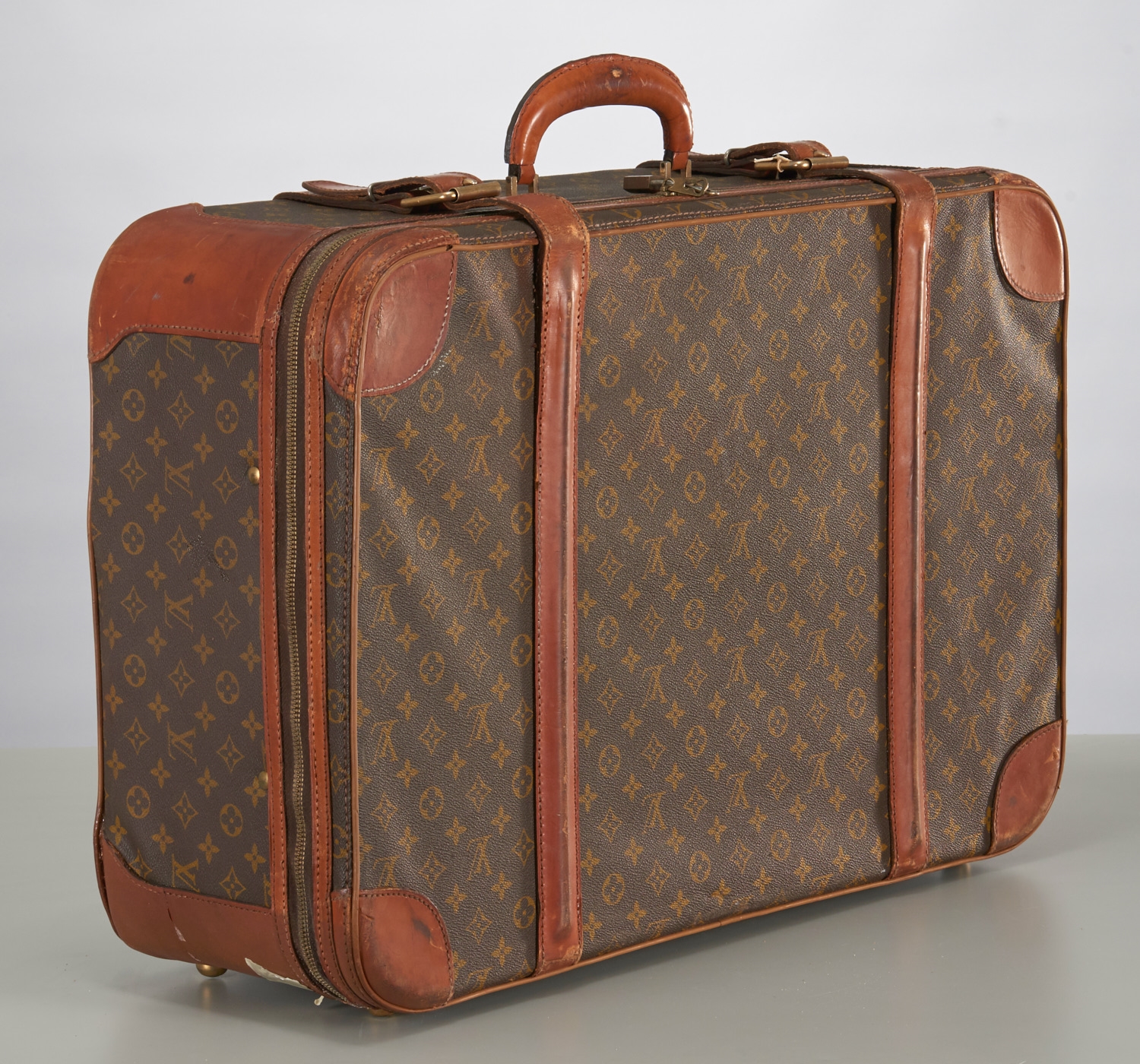 Louis Vuitton, Dimensions: (Suitcase) H 17 x W 25 Condition: Vintage wear  consistent with age and use. Wear to leather piping. Some thread loss to  straps. Some scratches and scuffs.