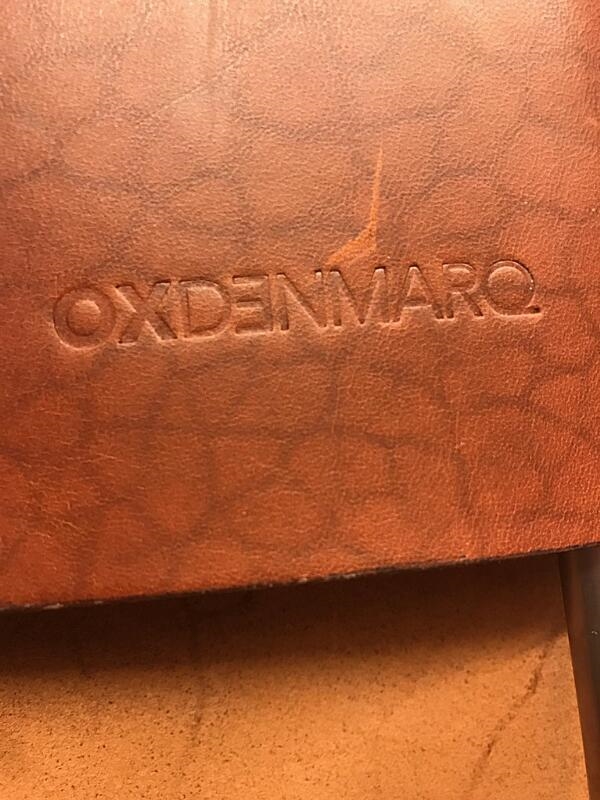 Artwork by Dennis Marquart, A pair of high-backed lounge chairs with stainless steel frame, Made of stainless steel