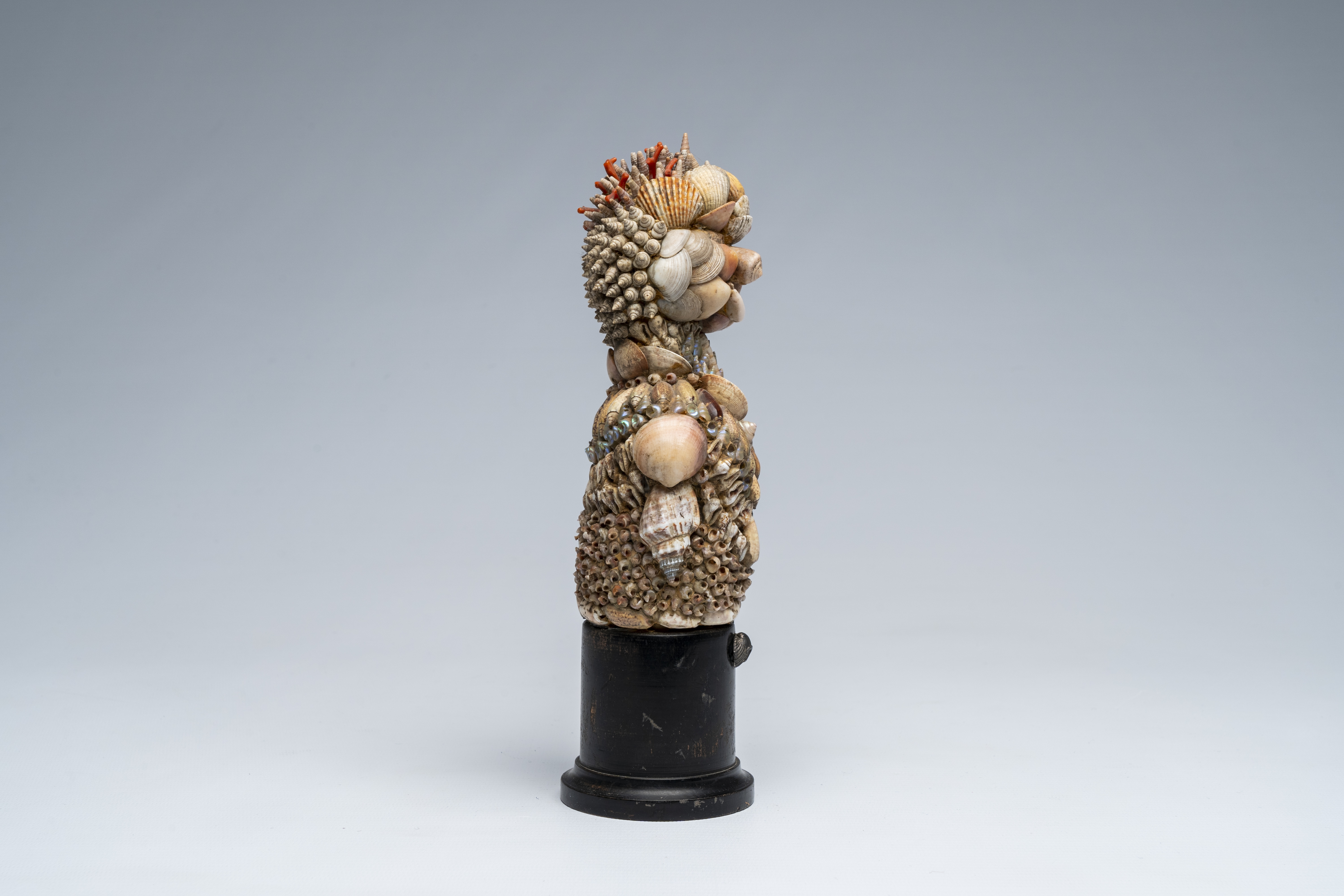 Artwork by Giuseppe Arcimboldo, A shells and coral figure on ebonised wood base with silver shell, Made of wood base with silver