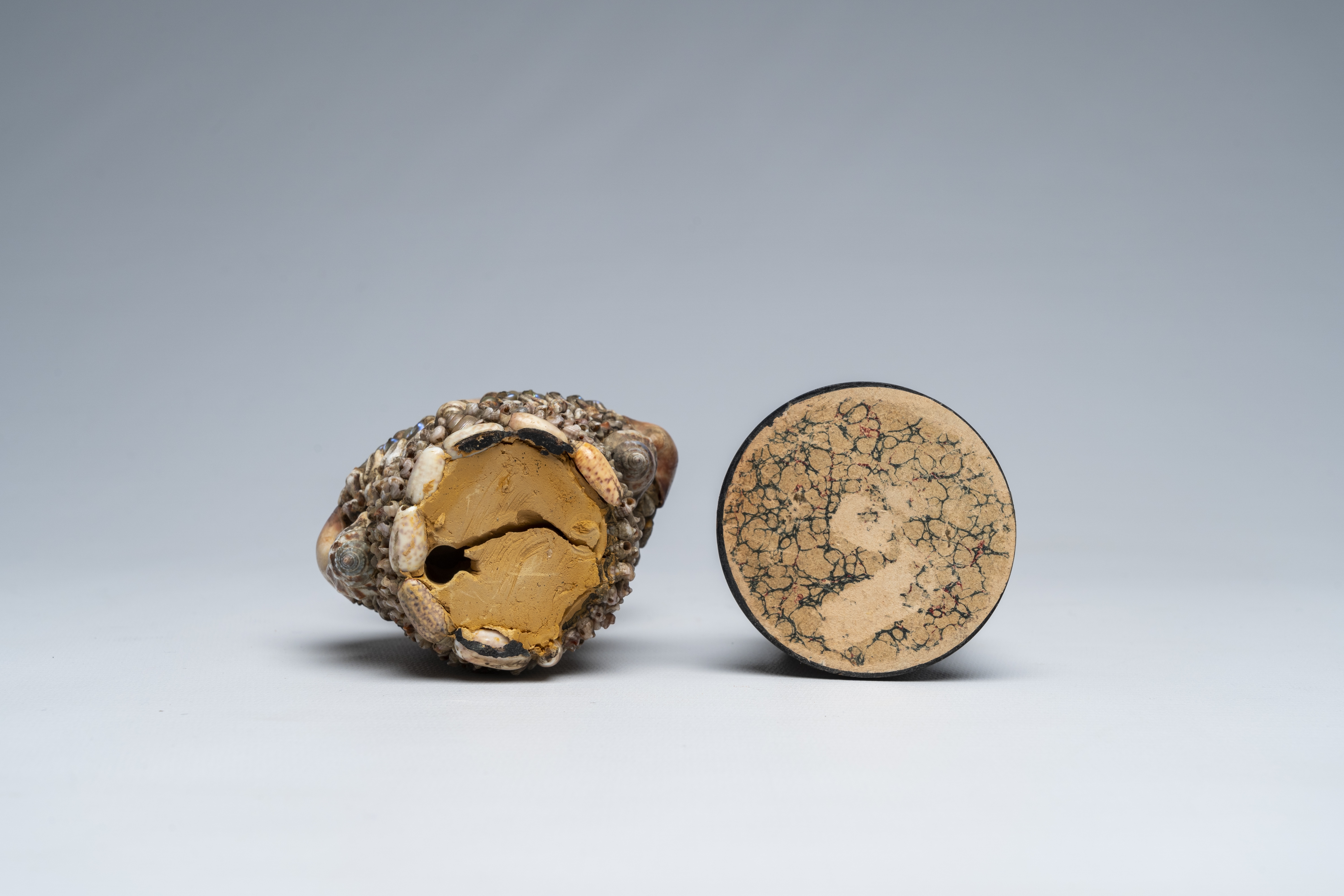 Artwork by Giuseppe Arcimboldo, A shells and coral figure on ebonised wood base with silver shell, Made of wood base with silver