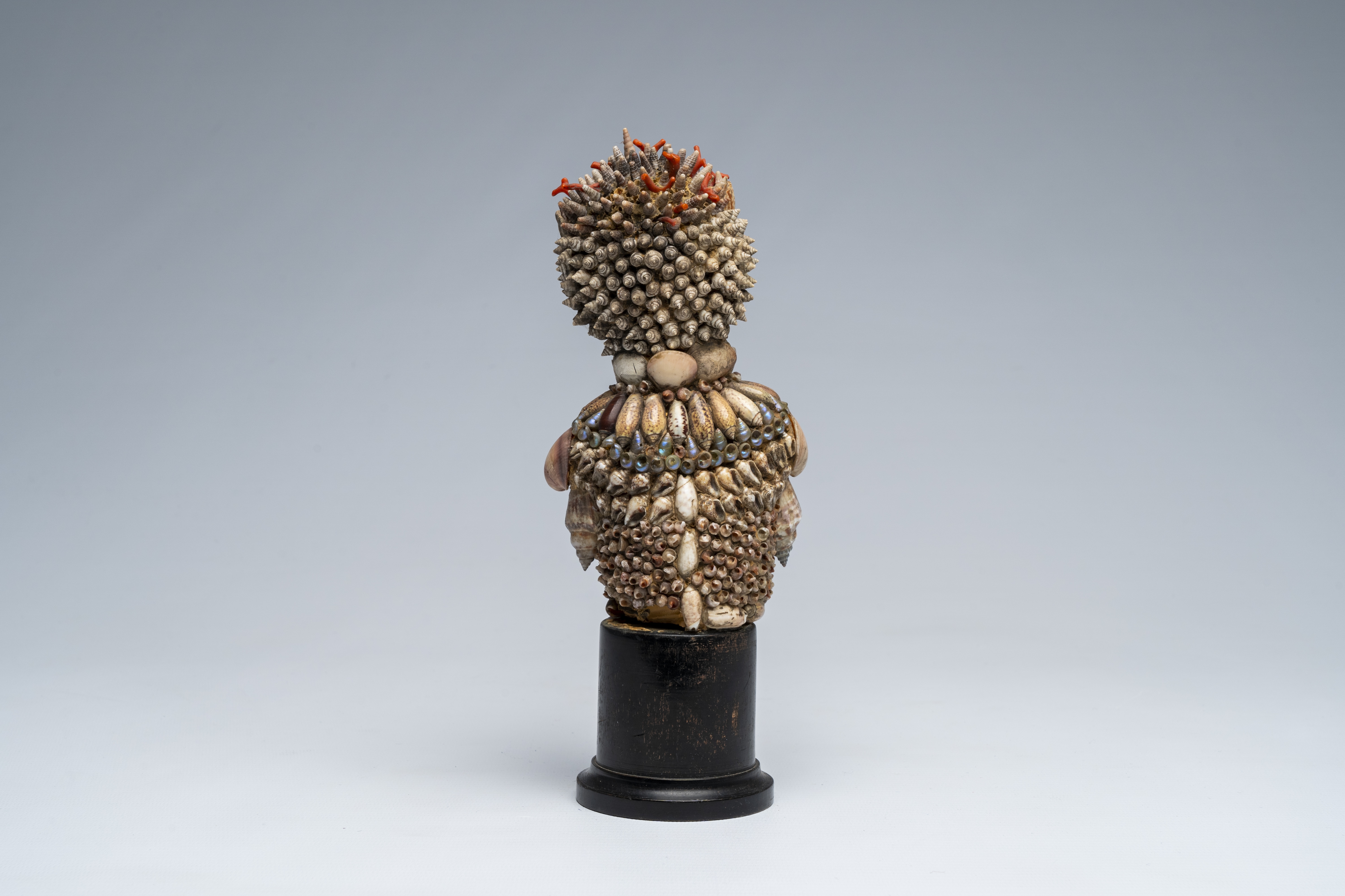 Artwork by Giuseppe Arcimboldo, A shells and coral figure on ebonised wood base with silver shell, Made of wood base with silver