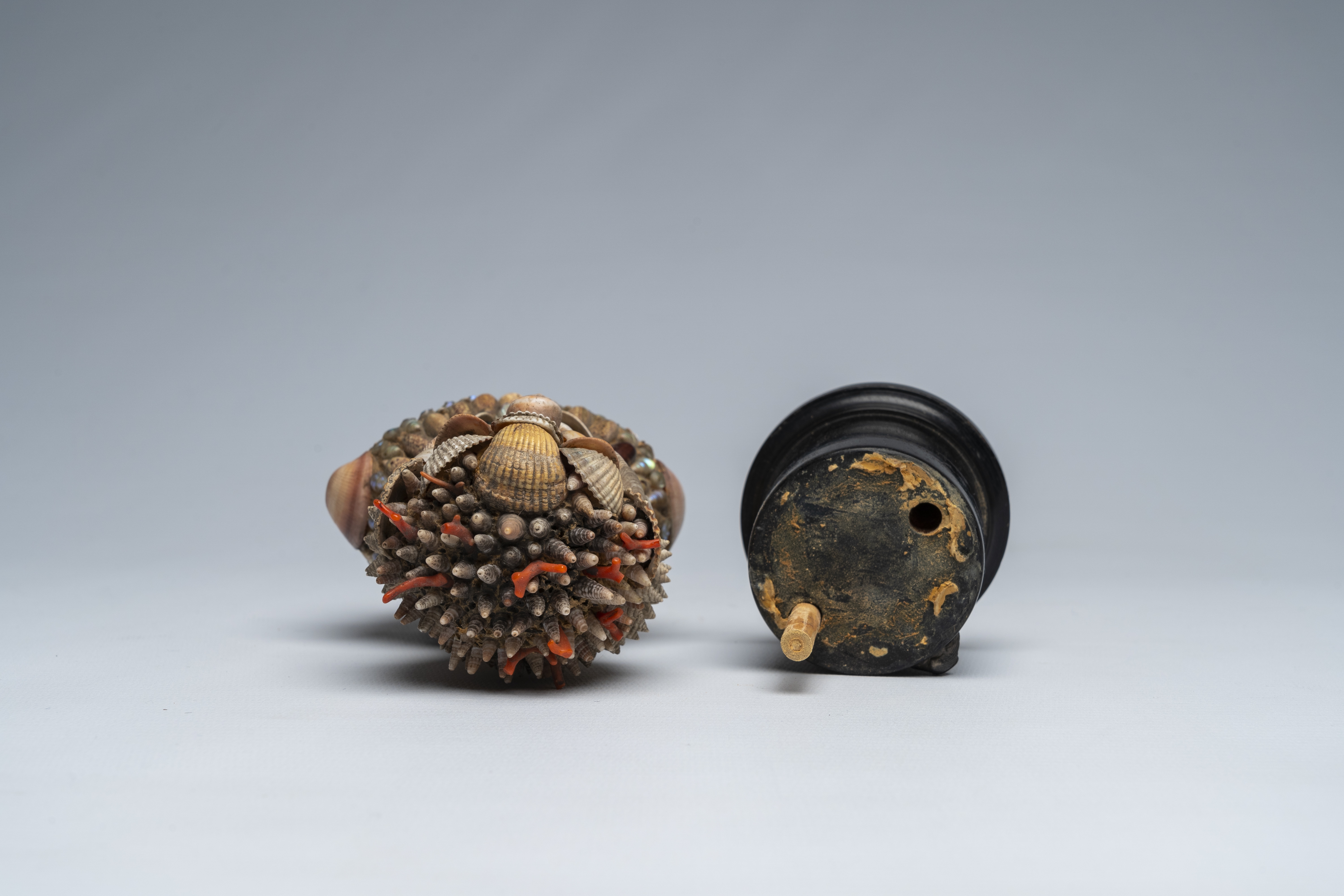 Artwork by Giuseppe Arcimboldo, A shells and coral figure on ebonised wood base with silver shell, Made of wood base with silver
