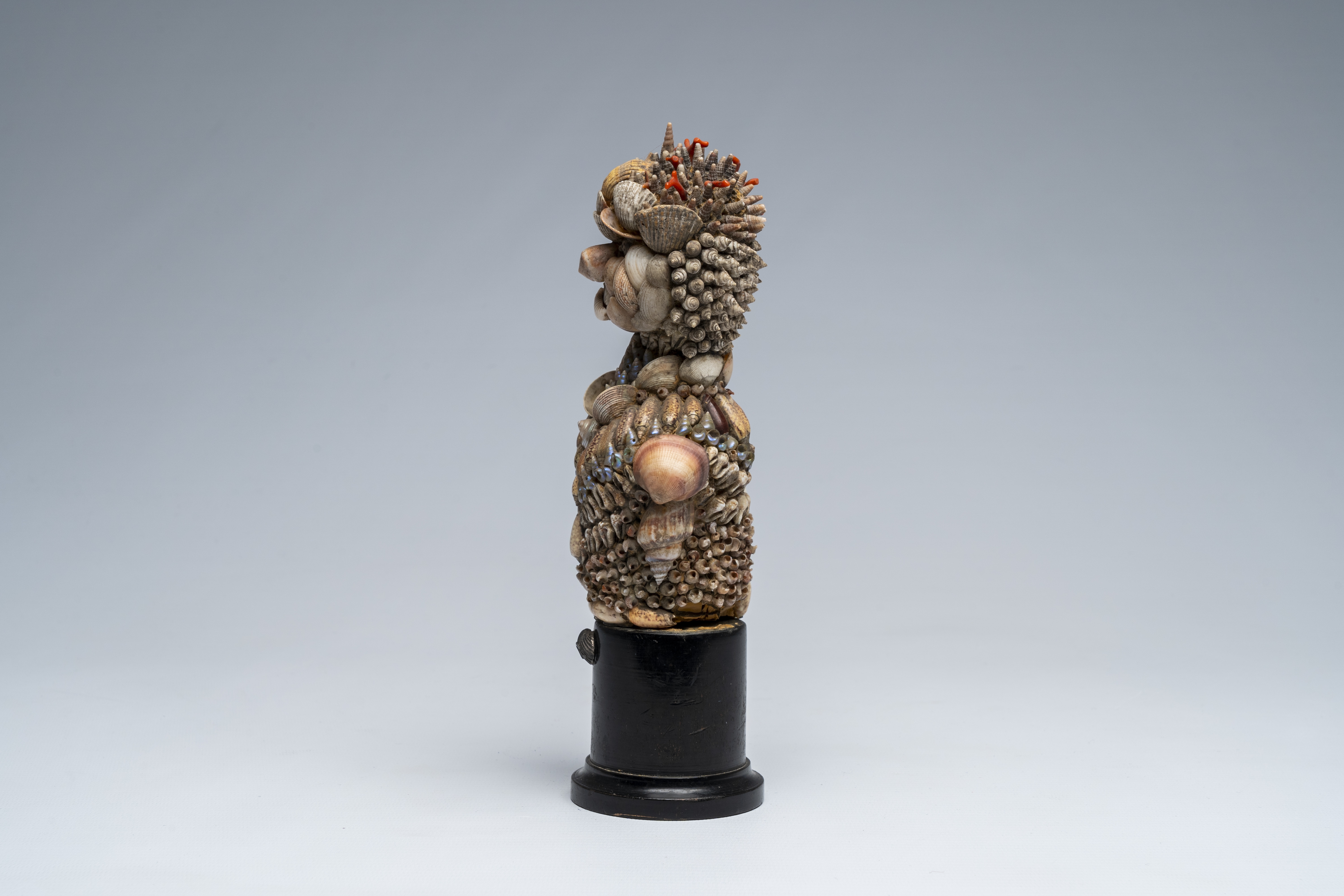 Artwork by Giuseppe Arcimboldo, A shells and coral figure on ebonised wood base with silver shell, Made of wood base with silver