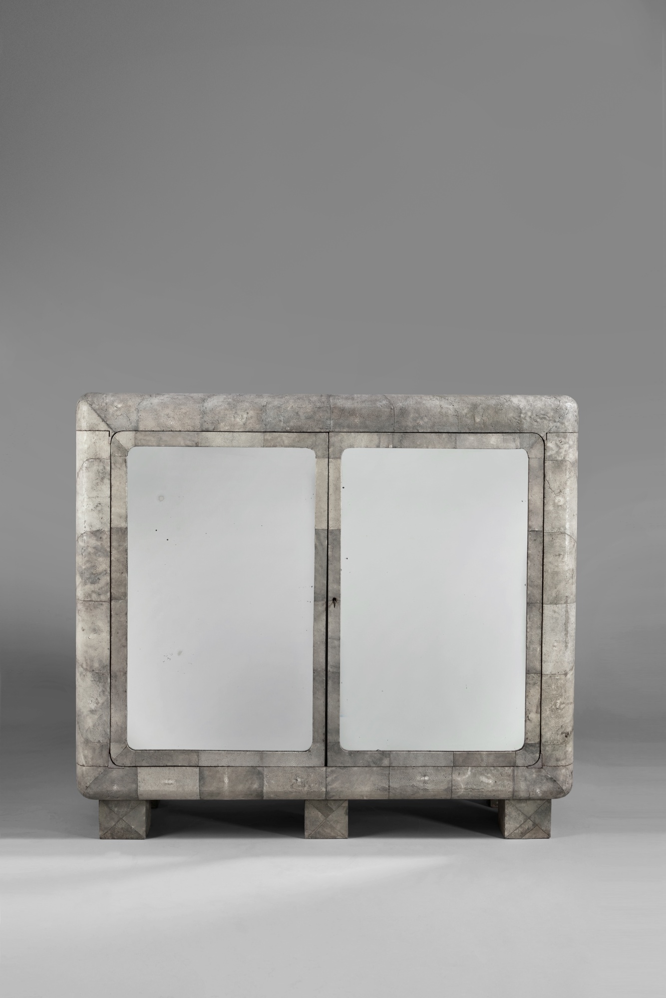Artwork by Pierre Legrain, A Rare Cabinet, Made of shagreen, mirrored glass, birdseye maple