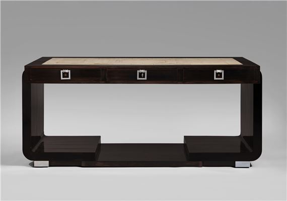 A sleek, dark wood console table with a light stone top and geometric silver hardware.