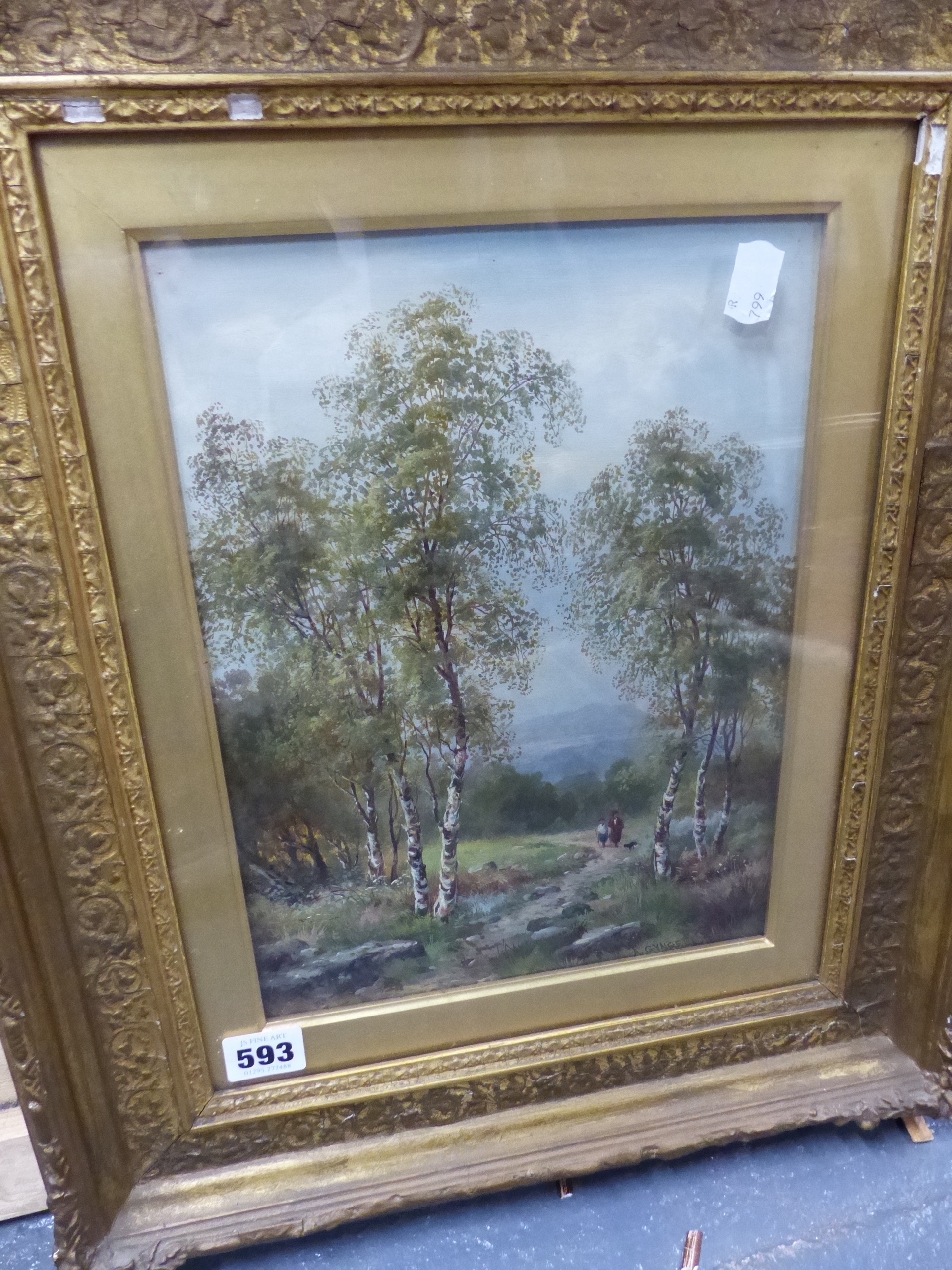 A framed landscape painting of birch trees in a field under an overcast sky.