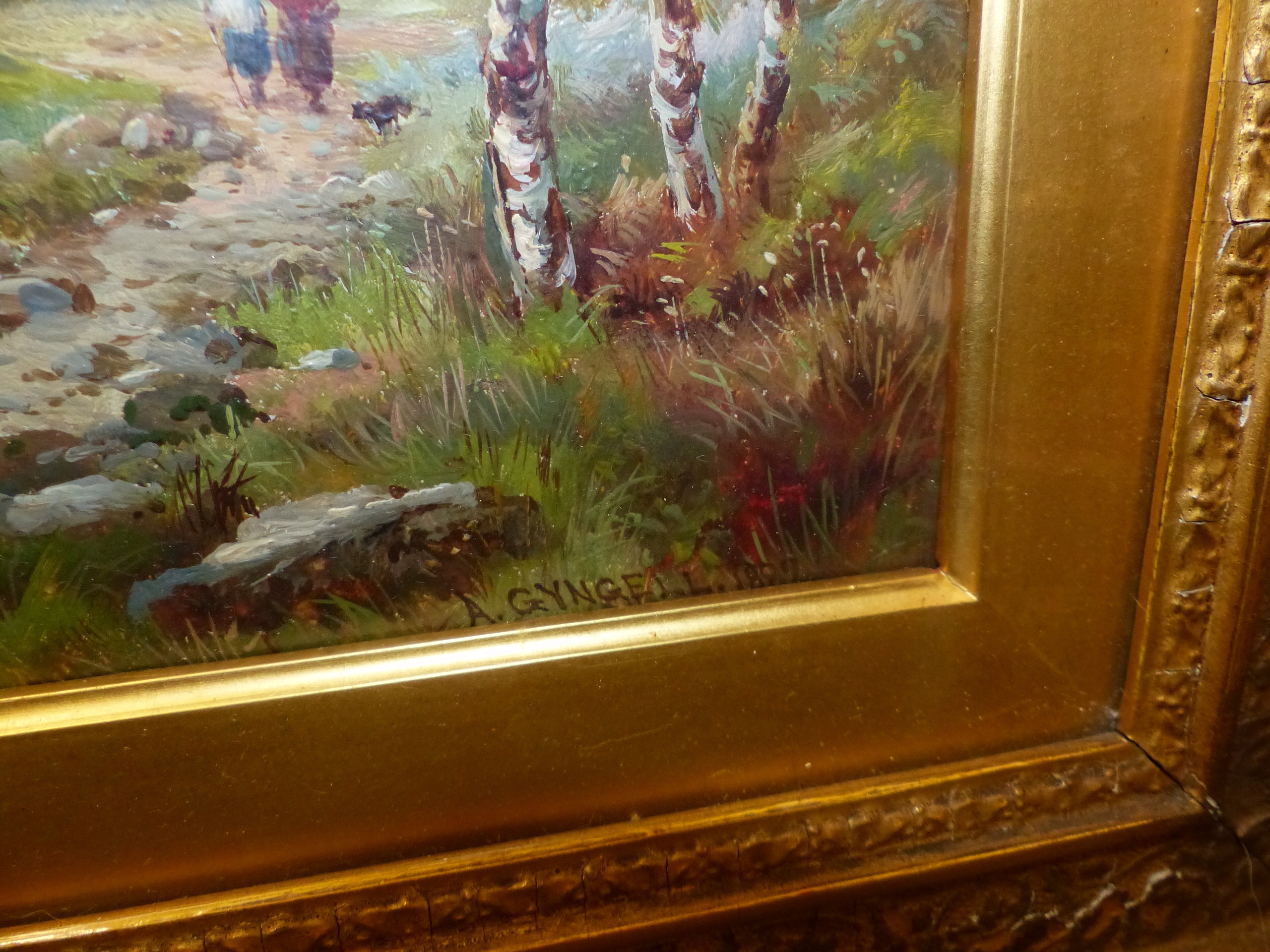 A framed landscape painting of birch trees in a field under an overcast sky.