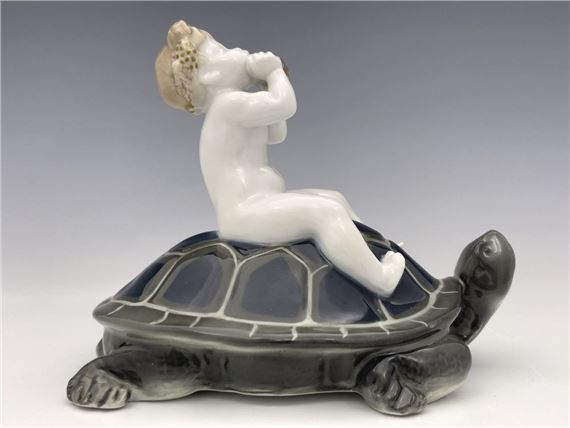 Figure of a boy playing the pan pipes on a tortoise, model K.320 by Ferdinand Liebermann