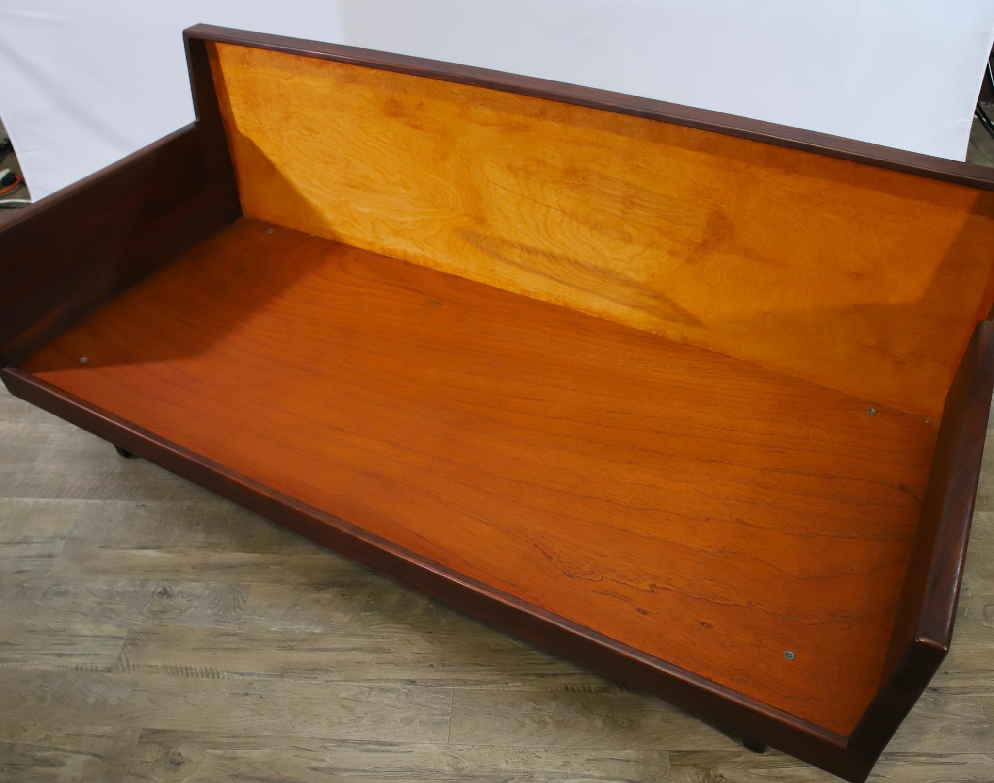 Artwork by Harvey Lowe, Sofa on slightly tapered square legs with multicolored diamond flame upholstered removable seat and back cushions, Made of olive green upholstery