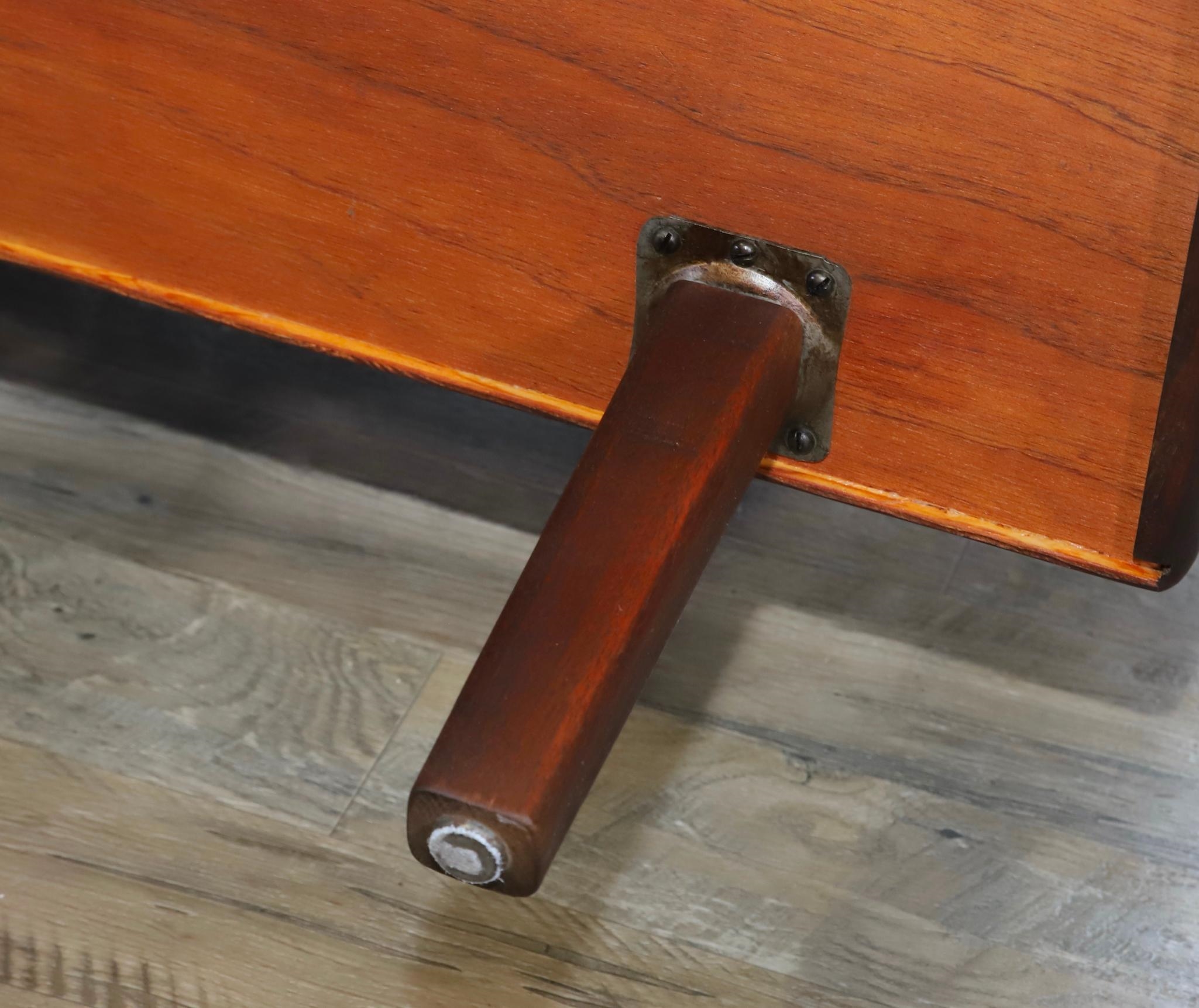 Artwork by Harvey Lowe, Sofa on slightly tapered square legs with multicolored diamond flame upholstered removable seat and back cushions, Made of olive green upholstery